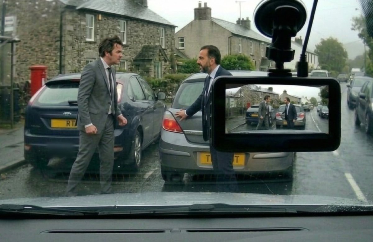 Road rage confrontation on a rainy UK street captured by dashcam